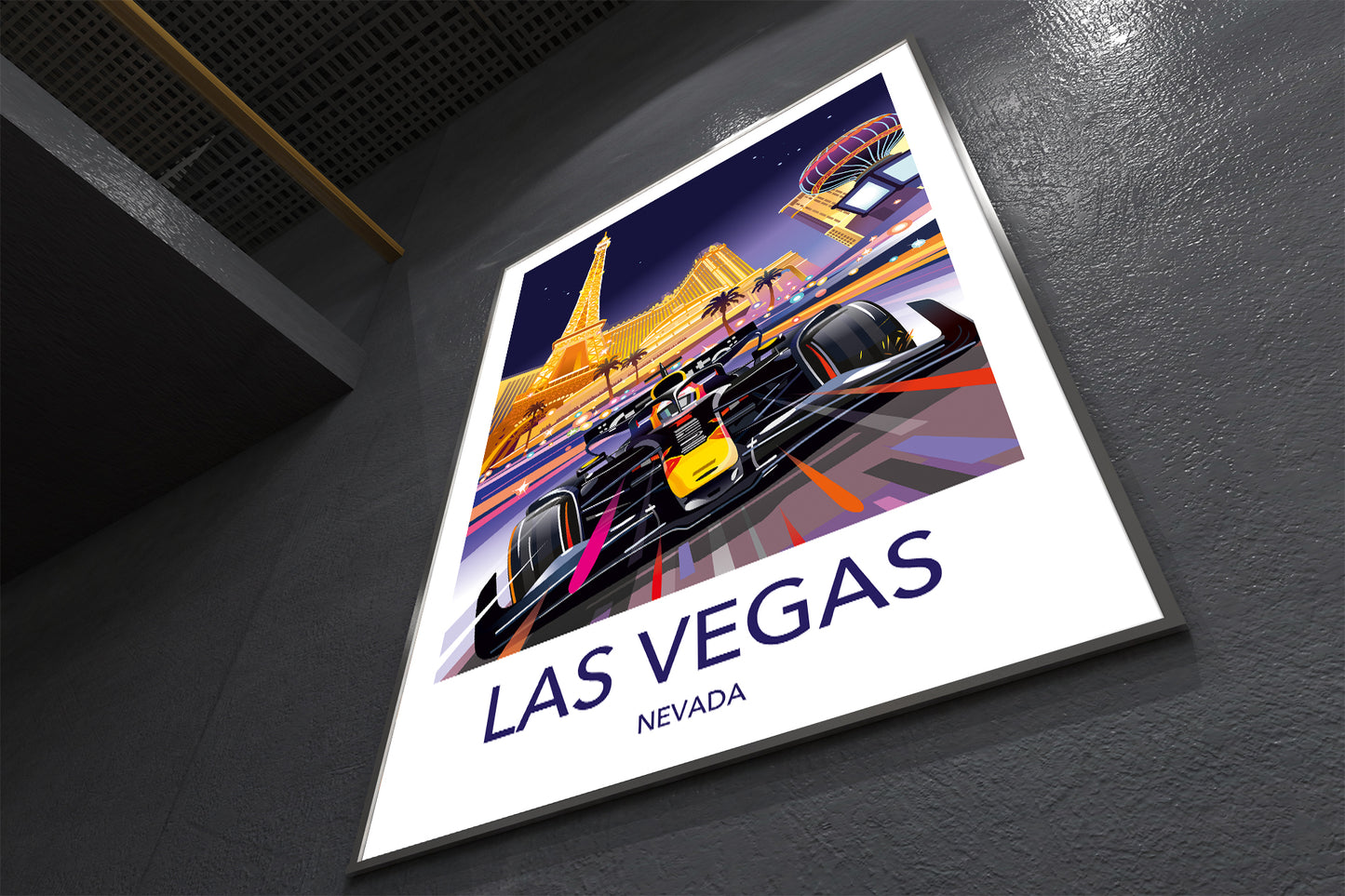 Poster of a race car on a track with 'Las Vegas Nevada' text, placed on a dark surface.